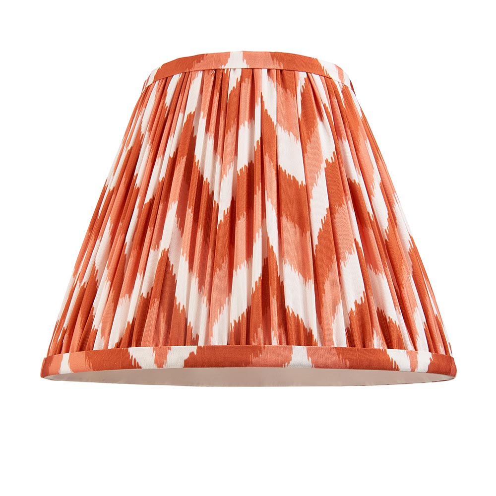 Carlworth Zigzag Table Lamp shade in pleated apricot and white zigzag faux silk with taped trim, shown alone on a white background.