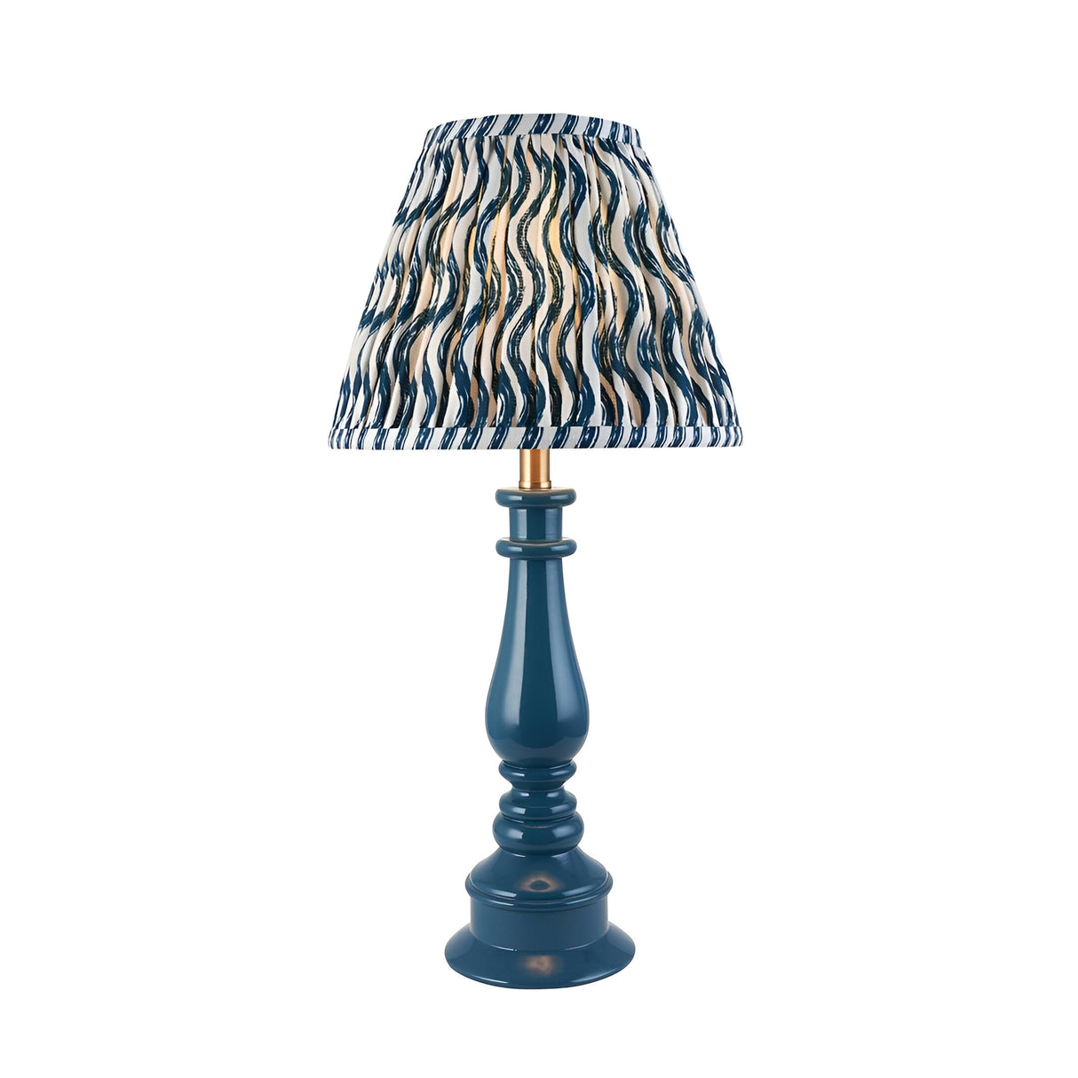 Carlworth Ripple Table Lamp in glossy blue resin with a turned spindle base, brass fitting, and pleated blue and cream patterned shade.