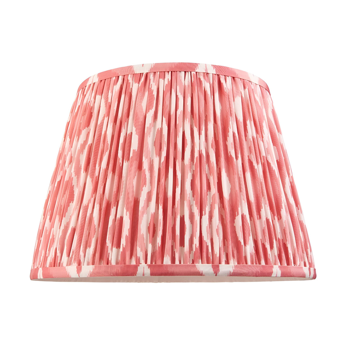 Amberley Ikat Table Lamp shade shown alone in pink and white patterned faux silk with pleated finish and coordinating trim, against a plain white background.