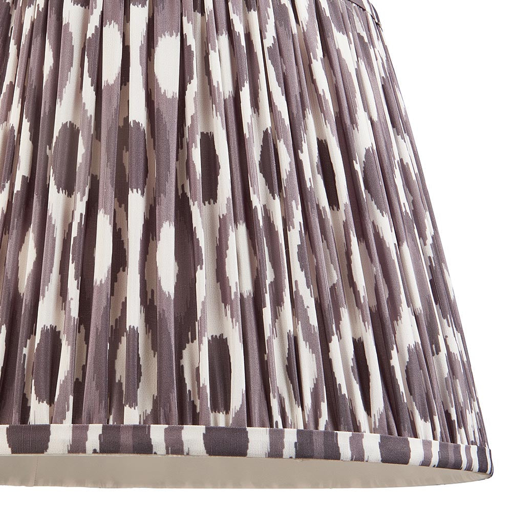 Close-up of the Amberley Ikat Table Lamp's pleated shade in grey and white ikat pattern faux silk, showing detailed fabric texture and trim.