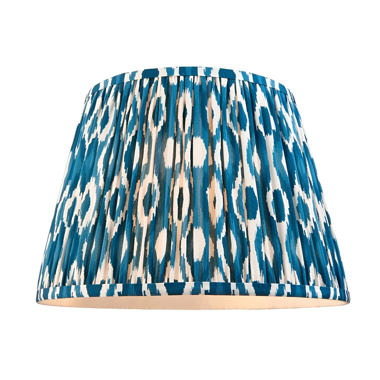 Ashbury Ikat Table Lamp shade in blue, cream and brown patterned fabric with a pleated, gathered design, shown on a plain white background.