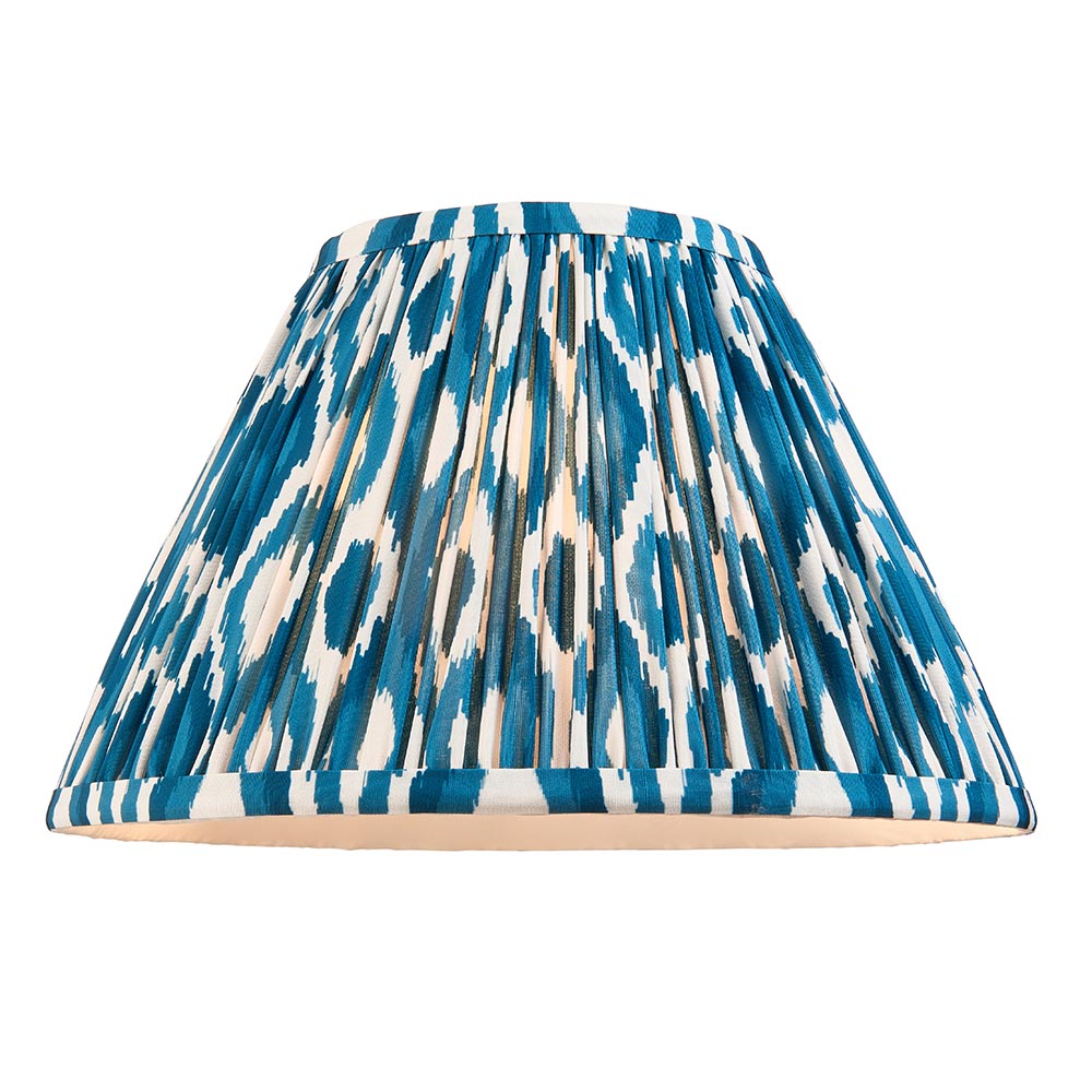 Caldford Ikat 30cm table lamp shade in blue, cream and natural ikat print fabric with pleated finish, shown against a plain white background.