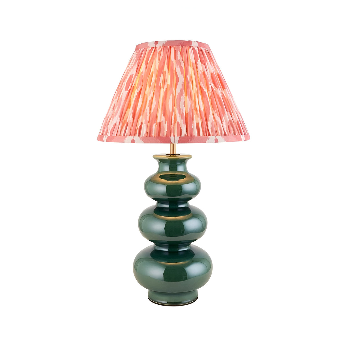 Carlstead Ikat Table Lamp with a tiered, glossy dark green ceramic base and a pink patterned pleated fabric shade, shown on a plain white background.