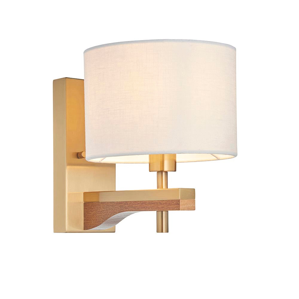 Endon Bramwell wall light with antique brushed brass bracket, oak-stained wood detail and natural faux-linen cylinder shade, on a white background.