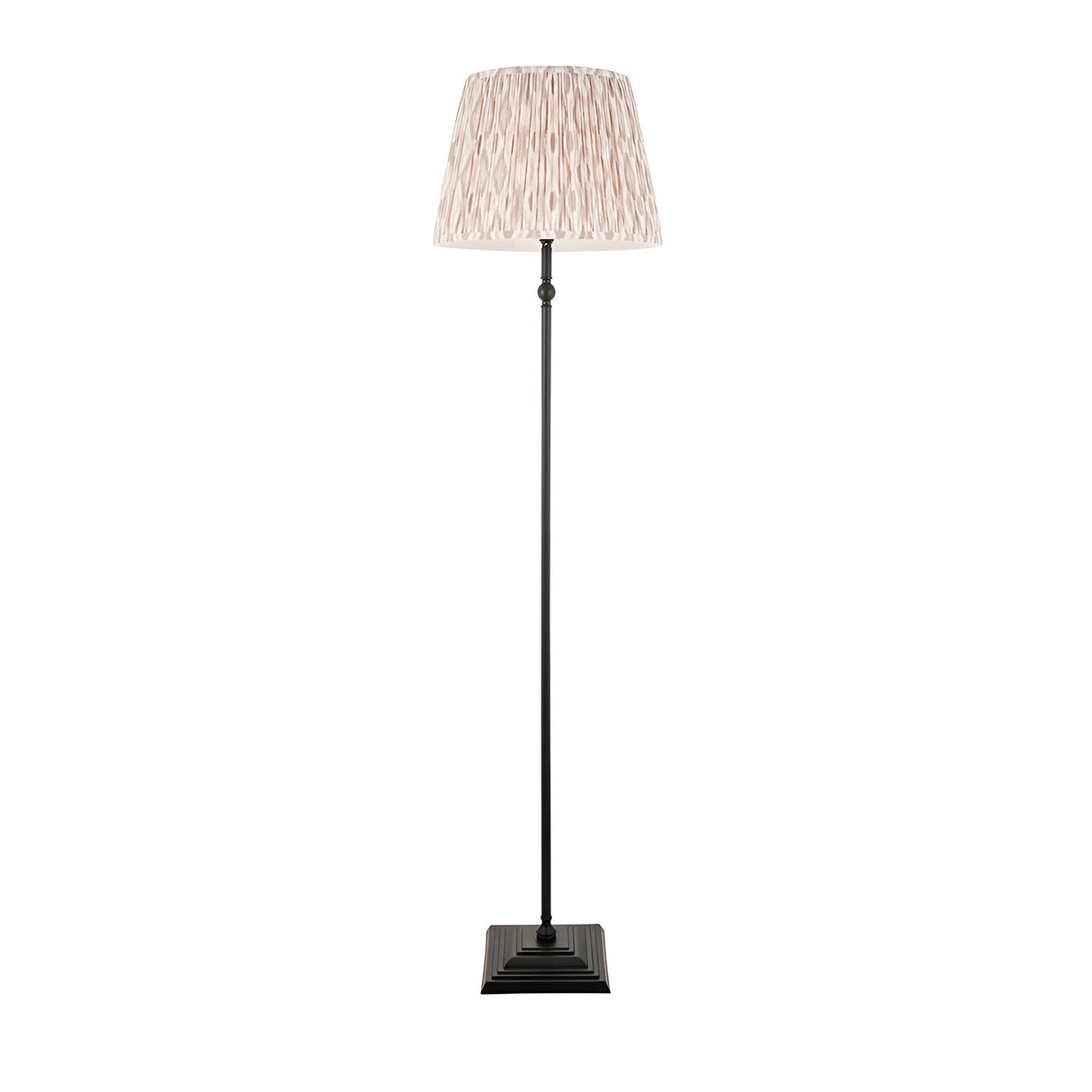 Caldmere Ikat Floor Lamp with matt black metal base and stem, topped by a pleated natural fabric shade, shown on a plain white background.