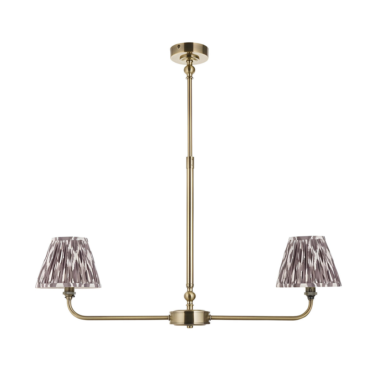 Caldmere 2 Light Ikat Pendant in Grey, a linear antique brass frame with two tapered pleated shades in pearl grey fabric, shown on a plain white background.