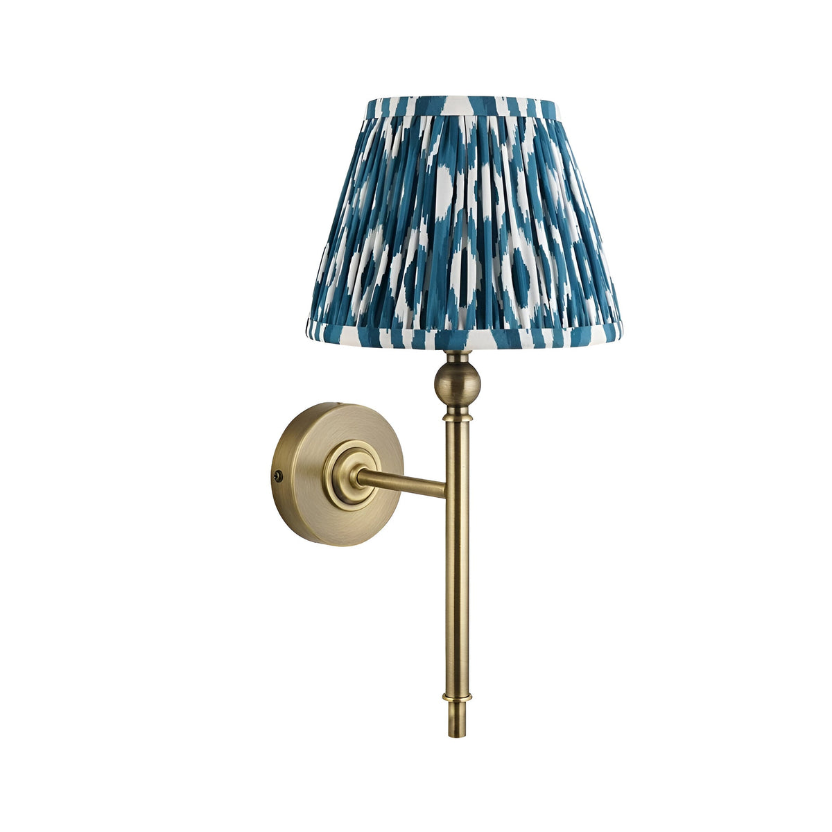 Caldmere Ikat Wall Light in Blue with a hand-pleated tapered fabric shade and antique brass wall mount, shown on a plain white background.