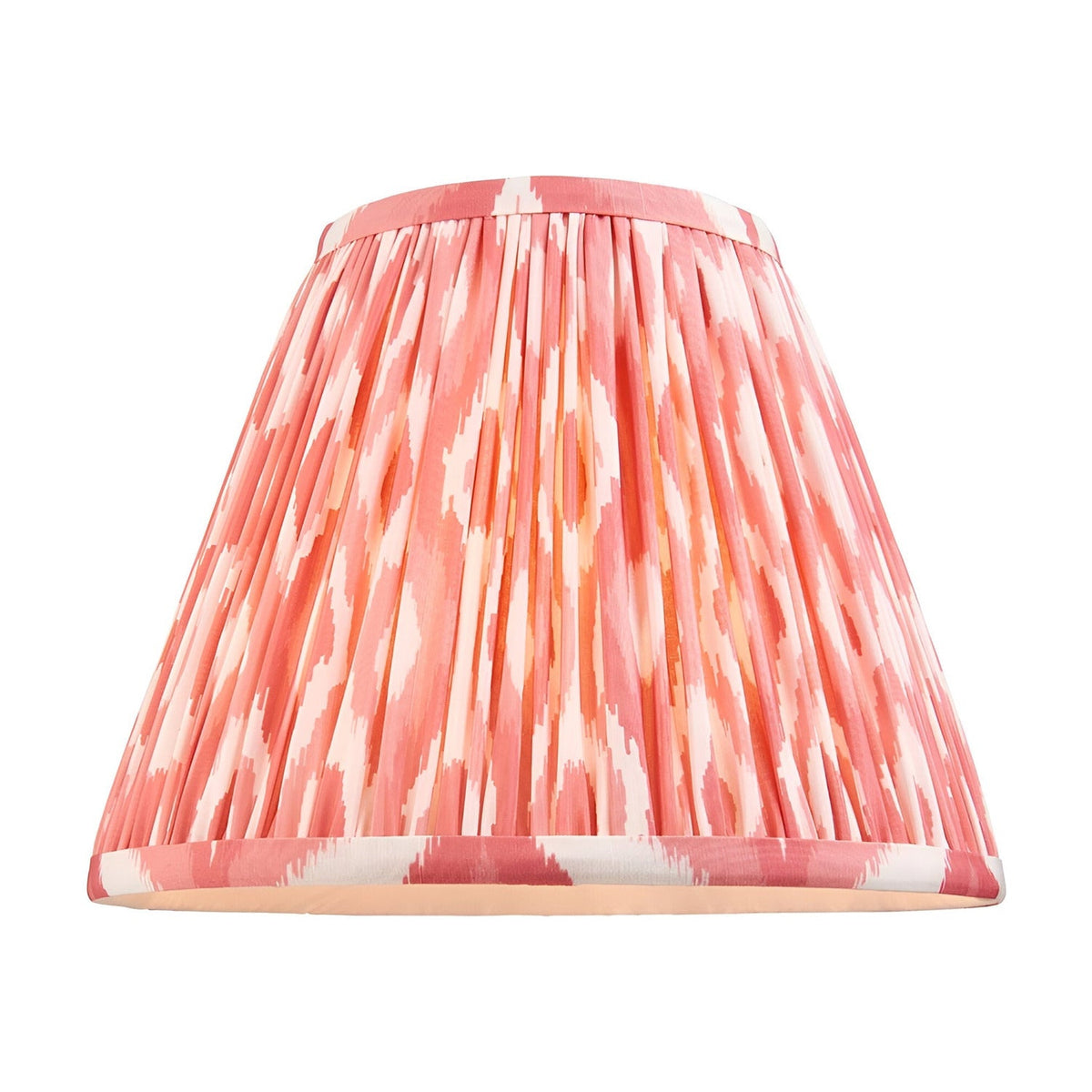 Caldmere Ikat Table Lamp shade in coral, a gathered pleated fabric design with an ikat pattern, shown on a plain white background.