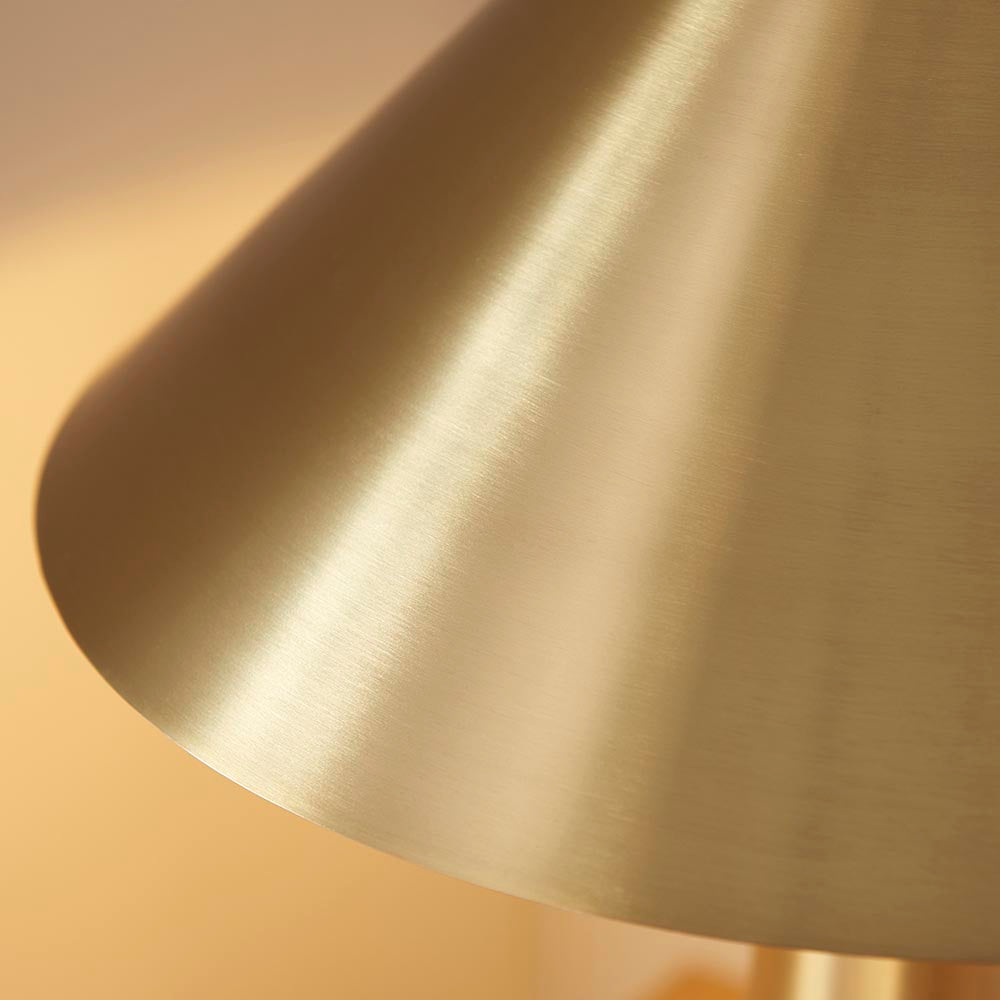 Close-up of the Endon Brockbourne table lamp shade in brushed aged brass, showing the wide conical form and warm metallic sheen.
