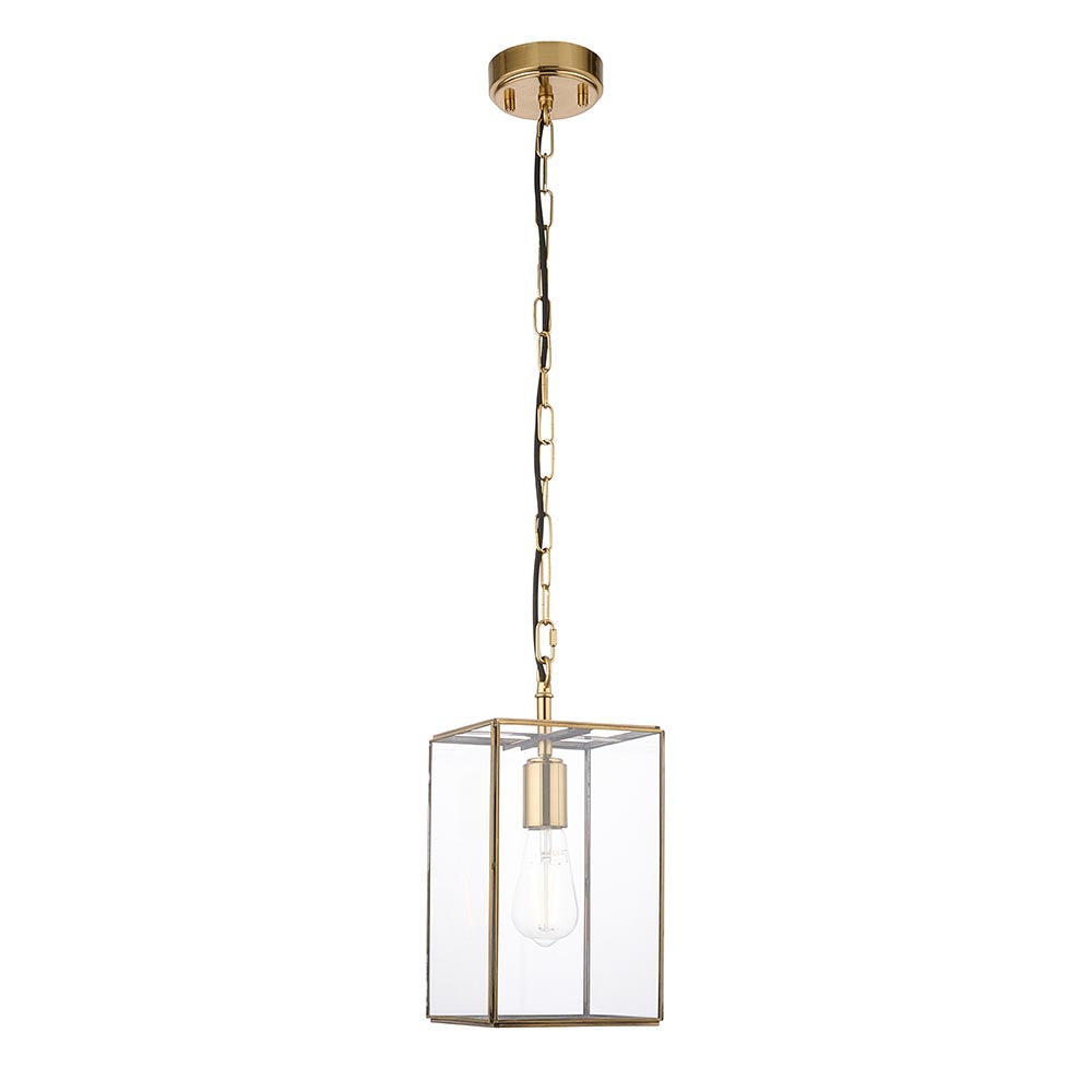 Haddon Pendant in brushed brass, single-light lantern-shaped fixture with clear glass panels and exposed E27 bulb, hung from a brass chain.