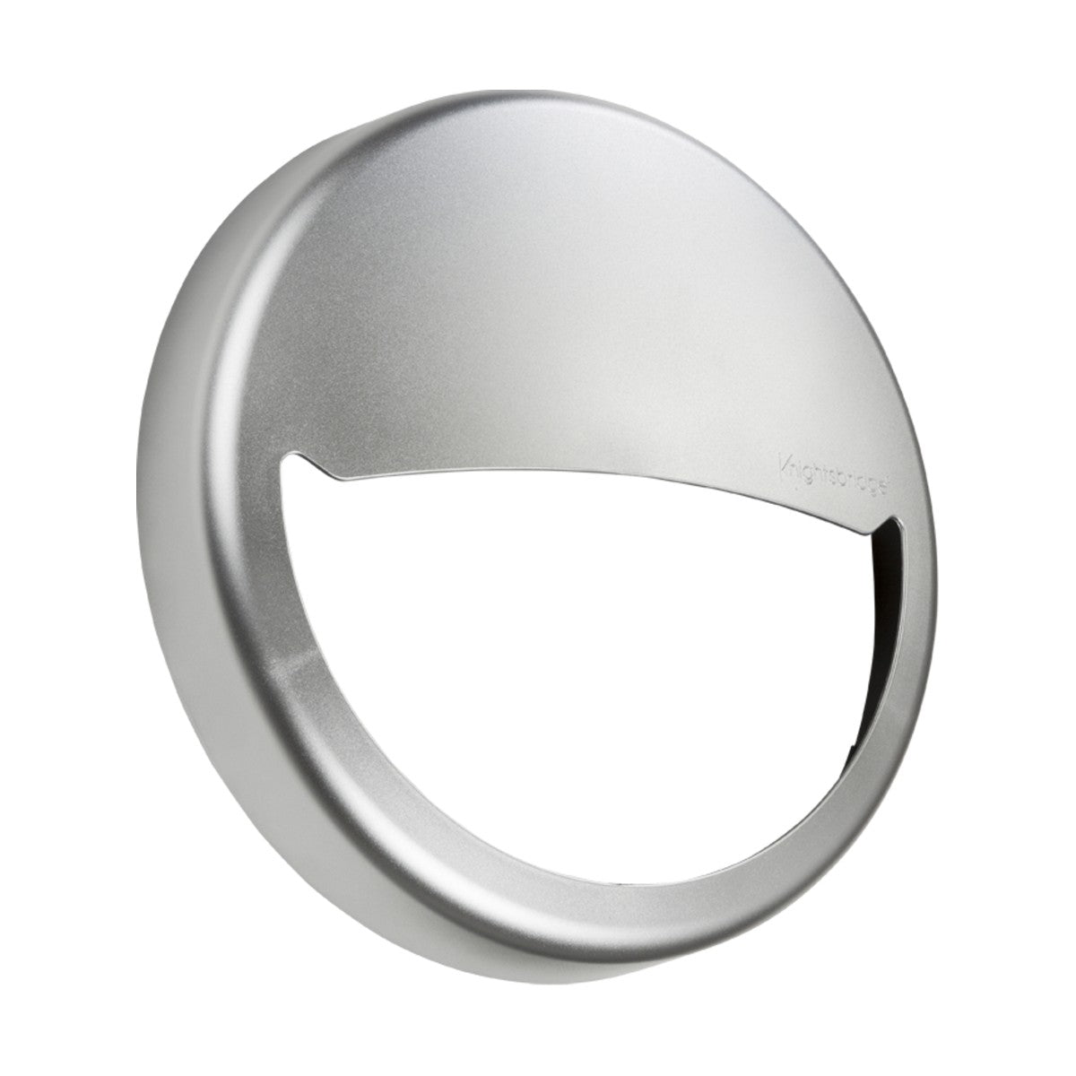 A silver, wall-mounted circular stainless steel toilet paper cover with a semi-open front features a minimalist design similar to the Eyelid Accessory For BT9 Range - Silver, boasting a sleek surface with a small embossed logo.