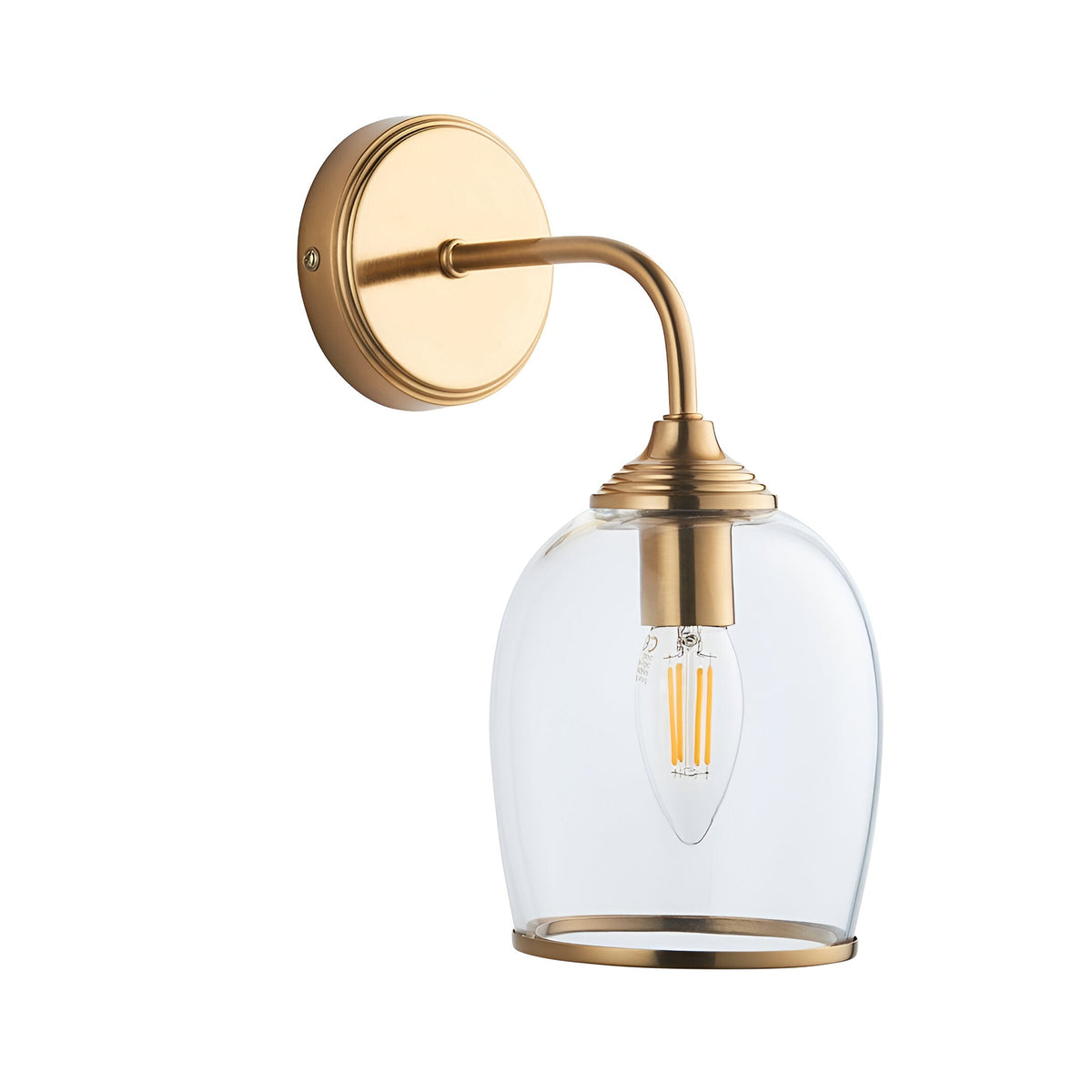 Halstead Wall Light in brushed brass finish with curved arm, round back plate, and clear domed glass shade holding an E14 bulb, shown on a white background.