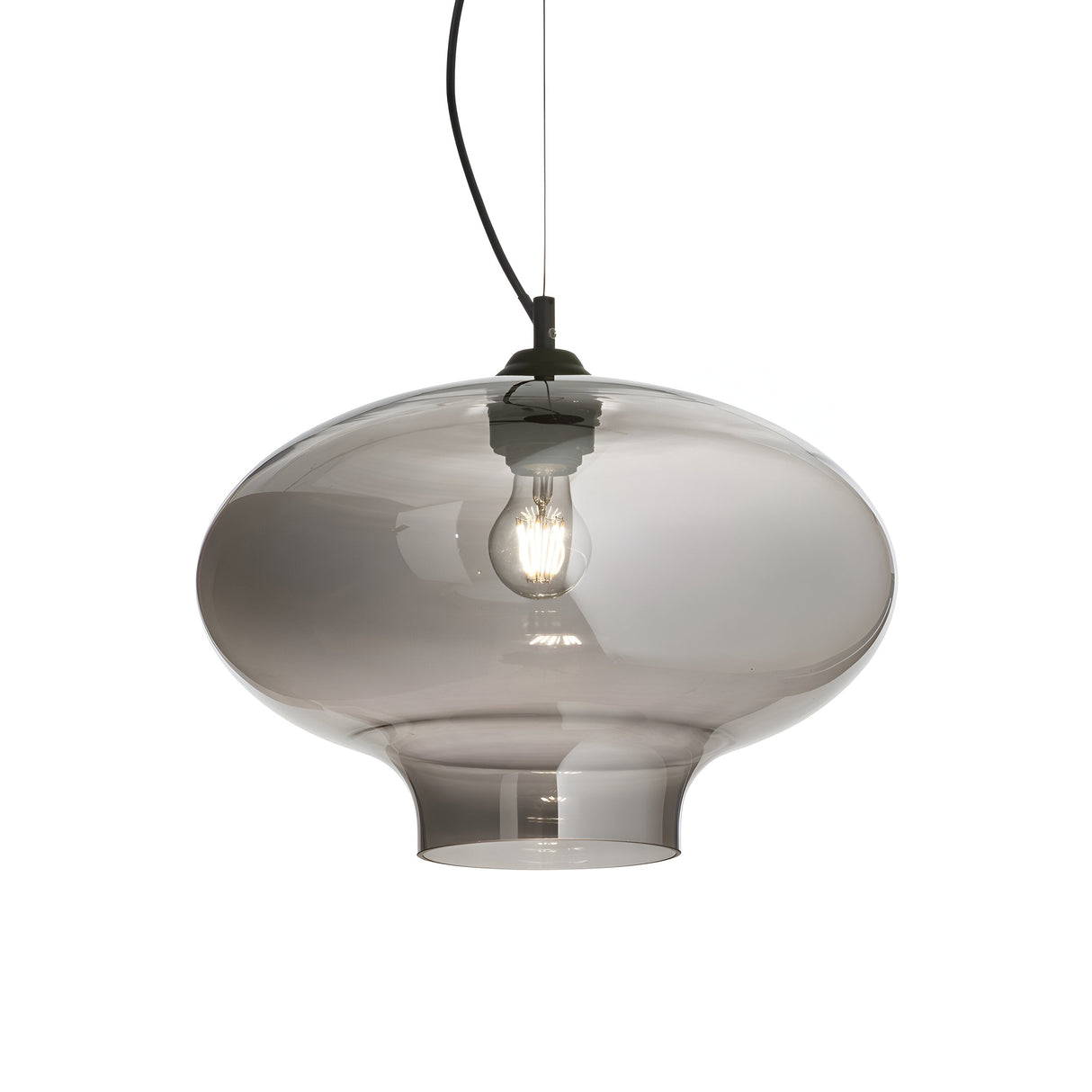 The Sky-2 1 Light Glass Pendant - Black is a modern pendant light featuring a soft, rounded shape with a transparent glass design. It hangs from a sleek black cord, showcasing a visible bulb within. The smoked glass diffuser adds a contemporary touch, enhancing its stylish appeal.