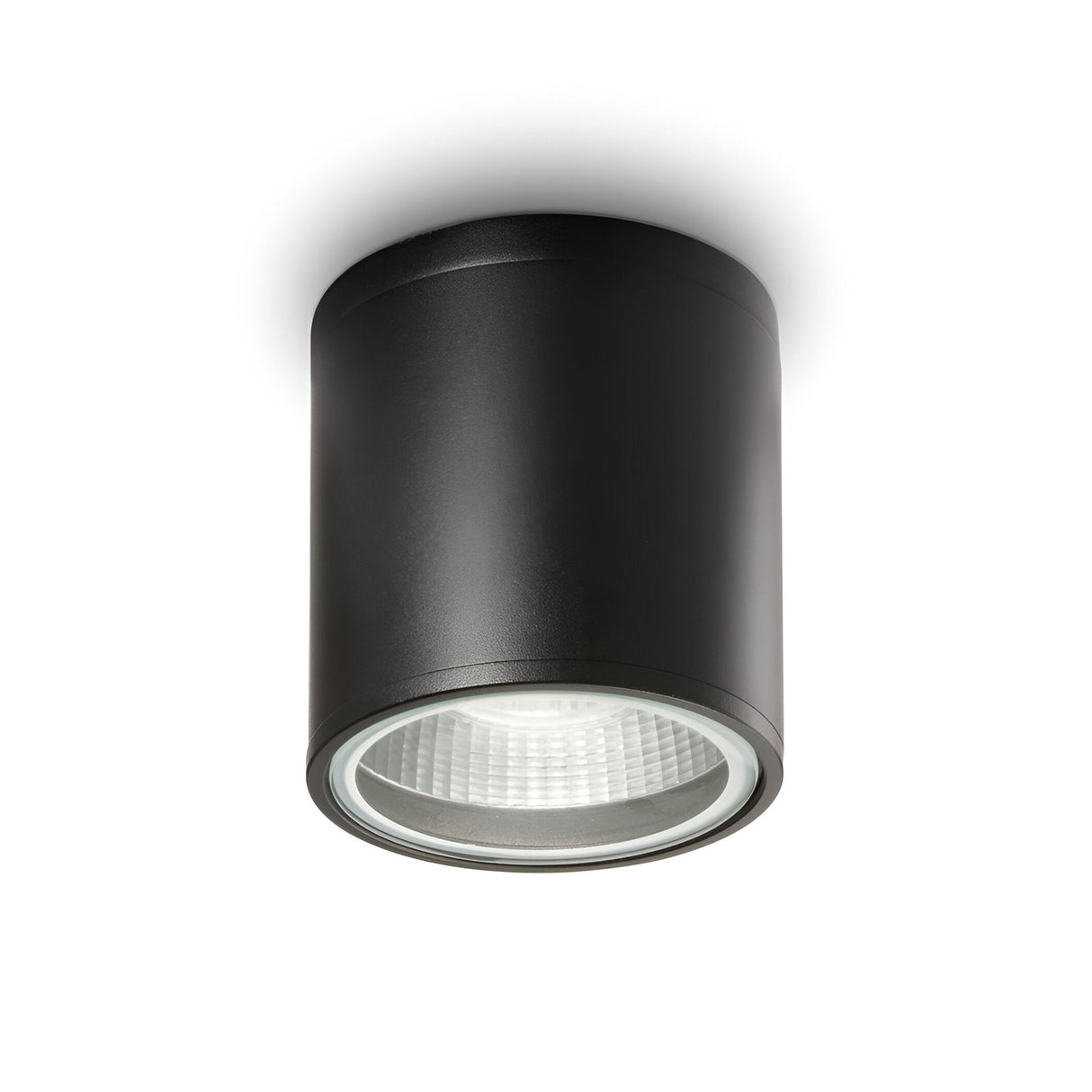 Introducing the Solar Downlight - Black: a sleek, cylindrical ceiling-mounted light fixture featuring a modern design with an IP44 rating. Its reflective inner surface directs light downwards, adding a contemporary touch to any room. An ideal choice for stylish outdoor lighting solutions.