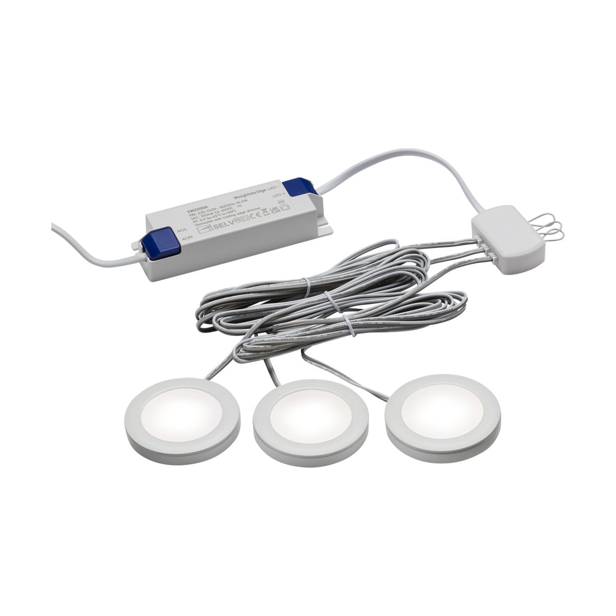 The 2.5W LED Under Cabinet Lights Dimmable White 3 Pack - 4000K are round puck lights that connect to a power adapter through tidy, looped cords. The adapter features a white body with blue ends. These circular, dimmable lights emit a cool white glow, enhancing any space with their soft illumination.