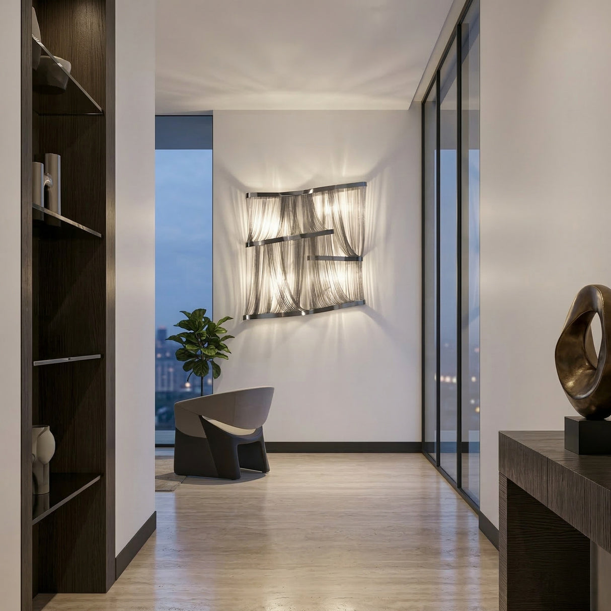 A modern, minimalist hallway featuring light wood floors, the Mireya 4 Light Metal Chain Veil Wall Light in Nickel, a gray chair by a large window with cityscape views, a potted plant, and dark wood furniture with chic decor accents.
