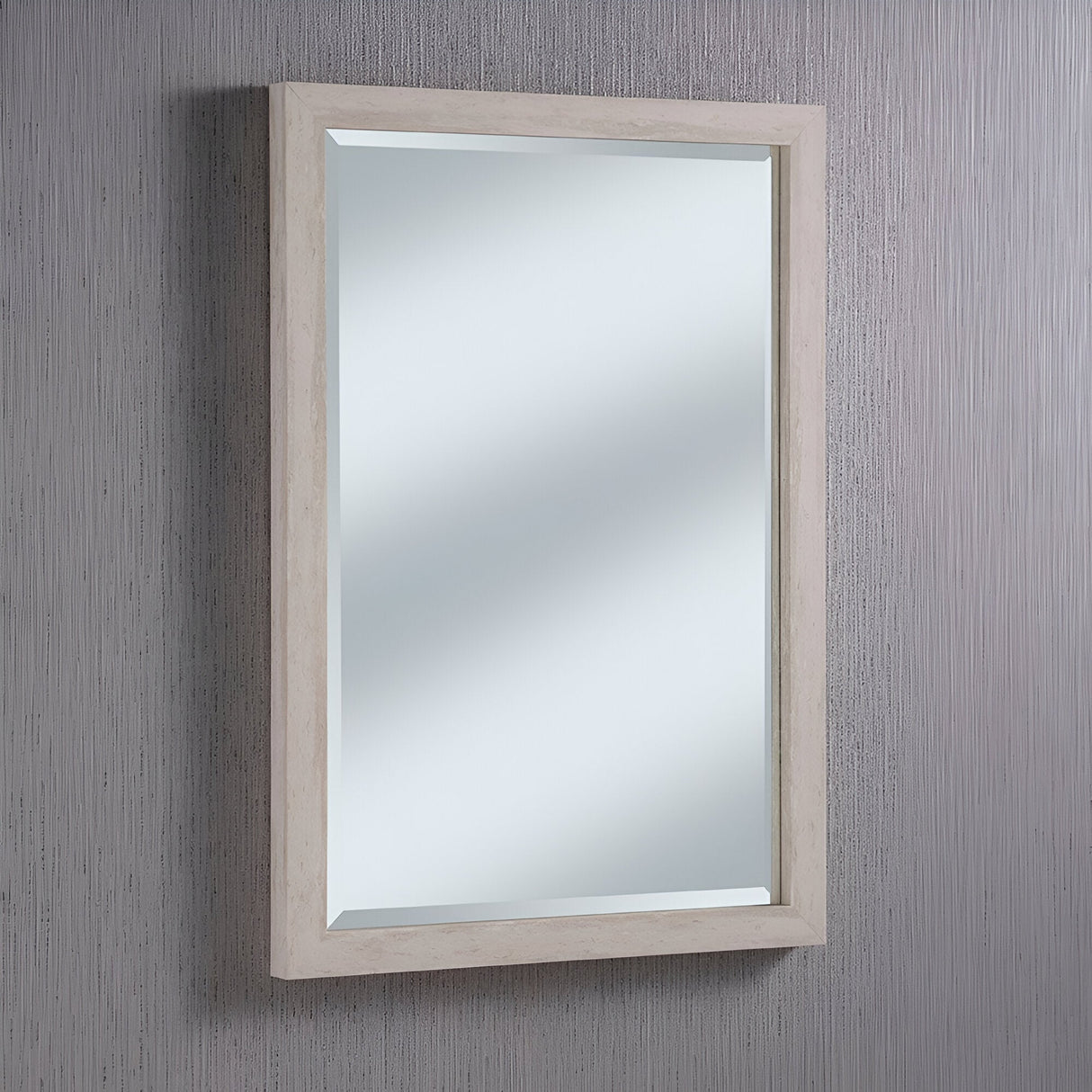 The Eden Rectangle Wall Mirror - Light Grey is mounted on a textured gray wall, representing modern elegance. It reflects light without displaying any visible objects, contributing a sophisticated touch to any home decor.