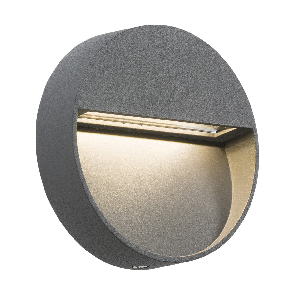 Introducing the Outdoor 3W LED Round Guide Light in Grey: a contemporary, round, wall-mounted LED wall light featuring a slanted cover. This versatile fixture serves as an IP44-rated outdoor light, encased in dark gray metal and ideal for pathway lighting by directing illumination downward.