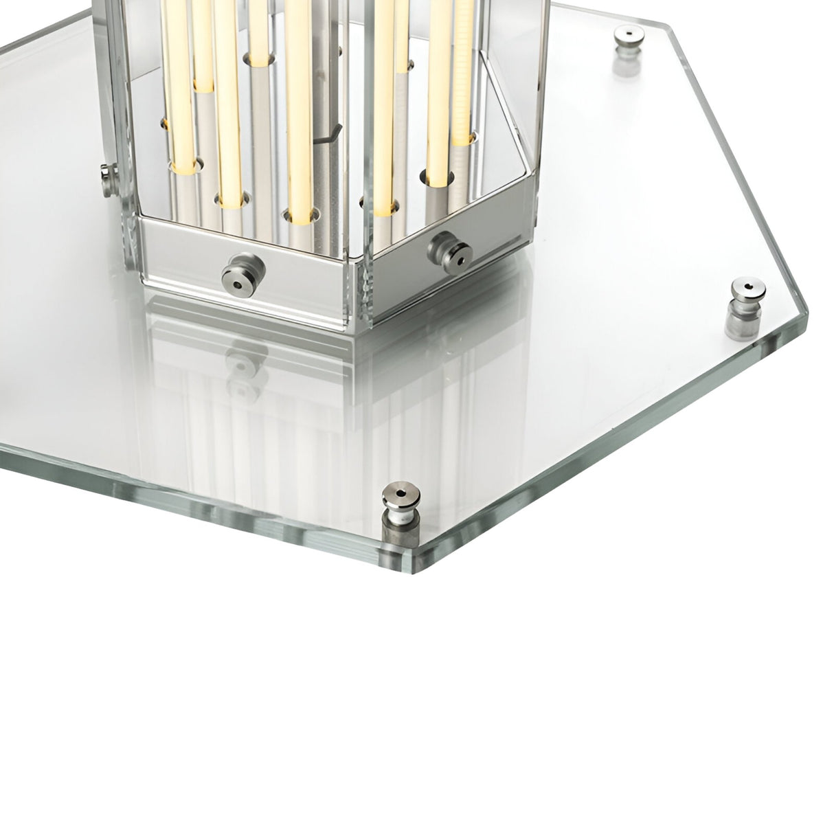 Close-up of the Vera Dimmable LED Strip Table Lamp - Clear, showcasing its hexagonal glass base, metal fixtures, and central metallic structure with vertical rods for a modern ambient lighting design.
