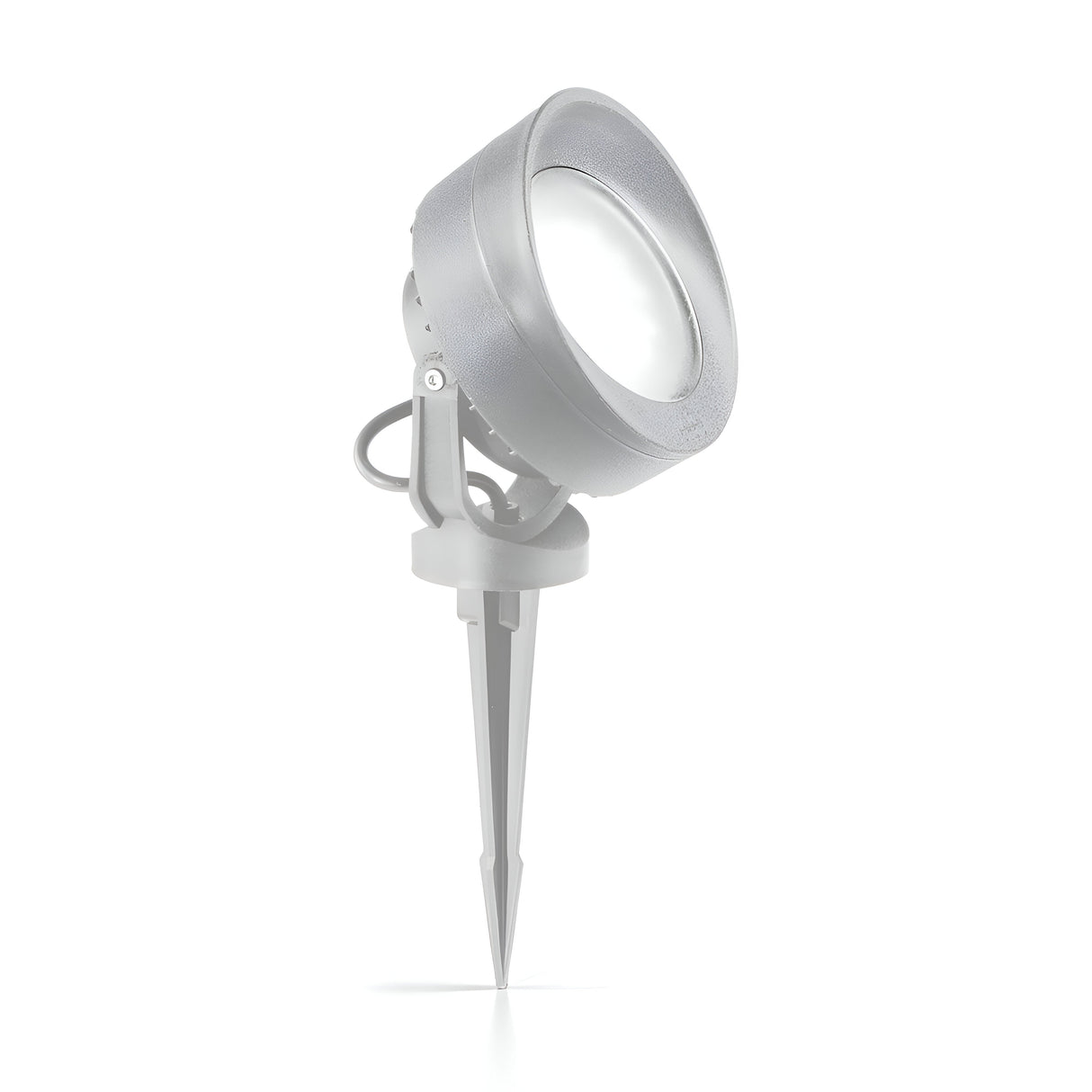 Presenting the Point-2 Outdoor Spot Spike Light in grey, constructed from durable high-performance resin. It features a round lamp and a pointed triangular stake for simple ground installation. This design is IP66 rated and includes a swivel mechanism for easy angle adjustments.