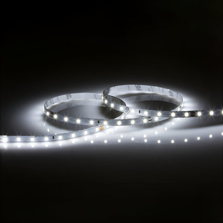 The 24V LED Strip Light 6000K - 3m emits a bright, cool white glow against a dark background. Its flexible design features individual light points, delivering high lumen output for a sleek and modern appearance.