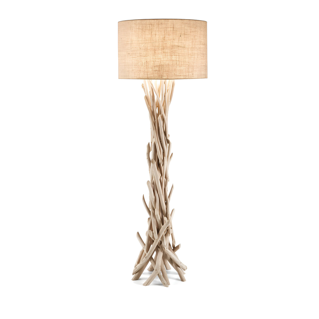 The Zone Large Wood Floor Lamp, in light brown, showcases a distinctive base crafted from intertwined driftwood branches. This design exudes rustic charm while elegantly supporting a spacious, round, beige lampshade, seamlessly blending natural wood elements with modern aesthetics.