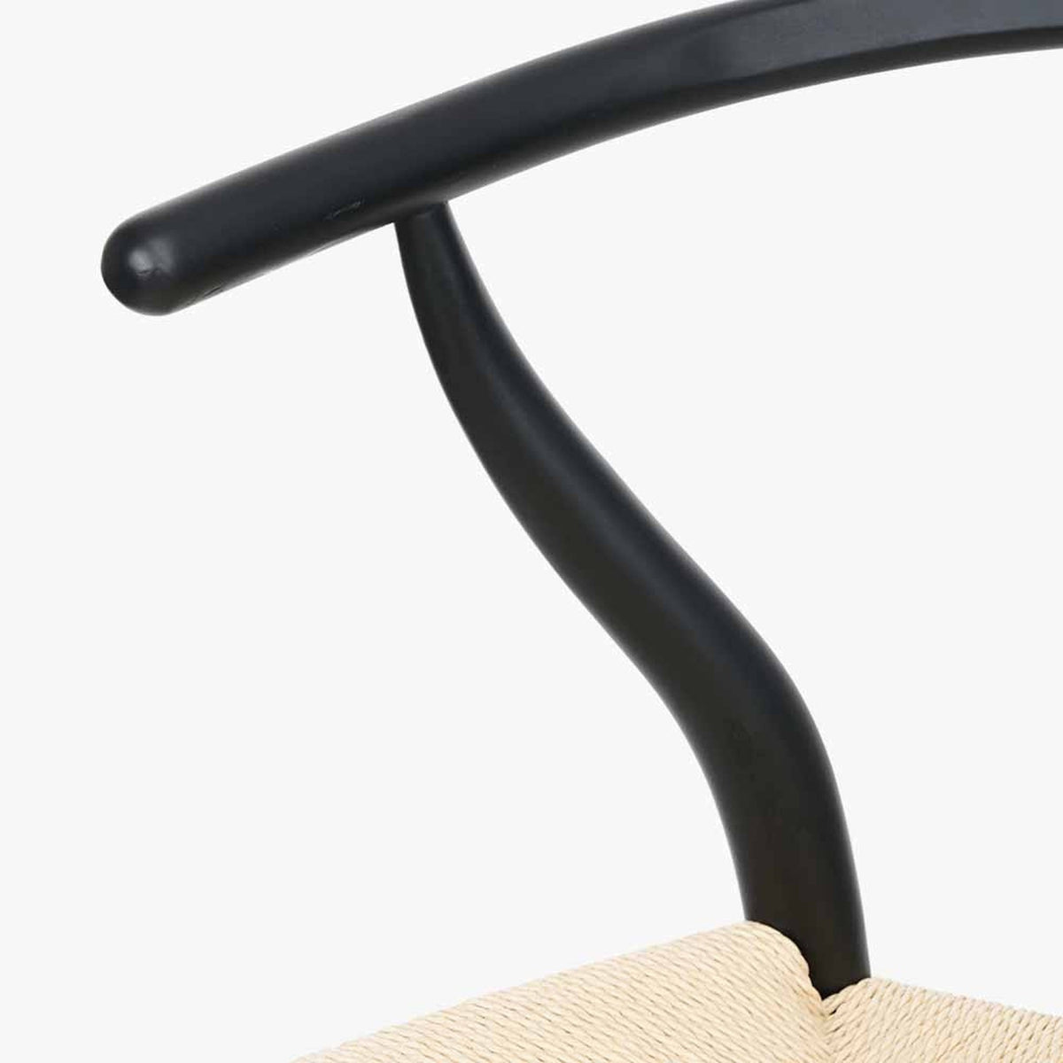 Close-up of the Quinn Black Beech & Paper Rope Dining Chair, showing the curved black beech frame joint and woven paper rope seat detail against a plain white background.