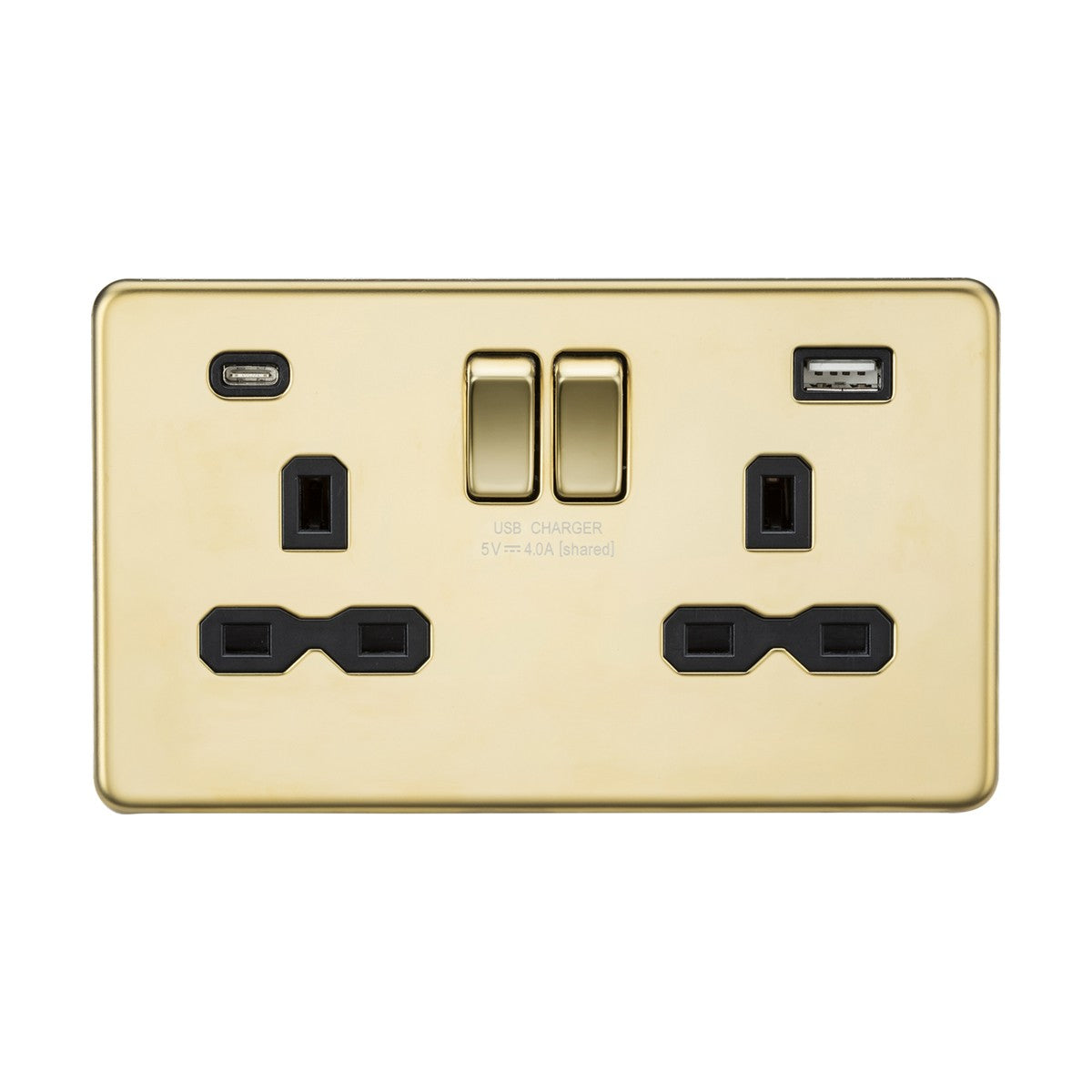 The "13A 2 Gang SP Switched Socket With Dual USB A+C" in polished brass features a black insert, highlighting two UK-style power sockets, dual USB A and C chargers, and centrally located switches. The screwless low profile design offers a glossy finish set against this elegant backdrop.