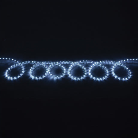 A string of LYYT 230V IP44 LED Rope Light 50m - 5000K is arranged in looped circles against a dark background, creating a cool white, glowing pattern.