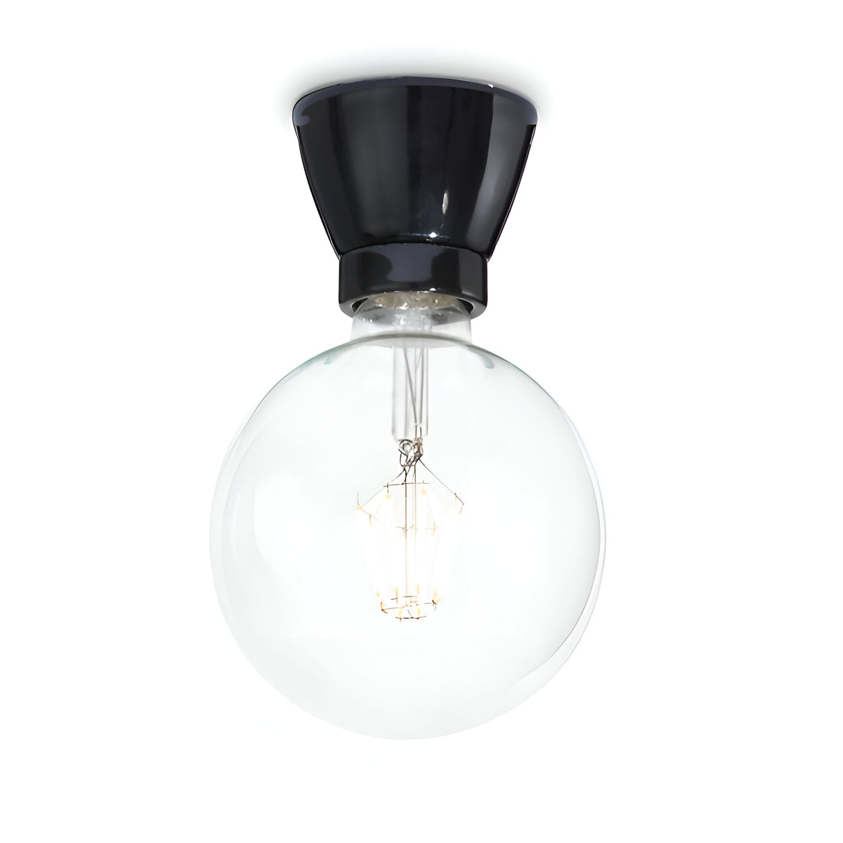 The Prismis Ceiling Light - Black features a clear globe light bulb with a visible filament elegantly mounted on a black enamel socket. The bulb emits a soft glow and is affixed to the ceiling fixture, highlighting its minimalist and modern design.