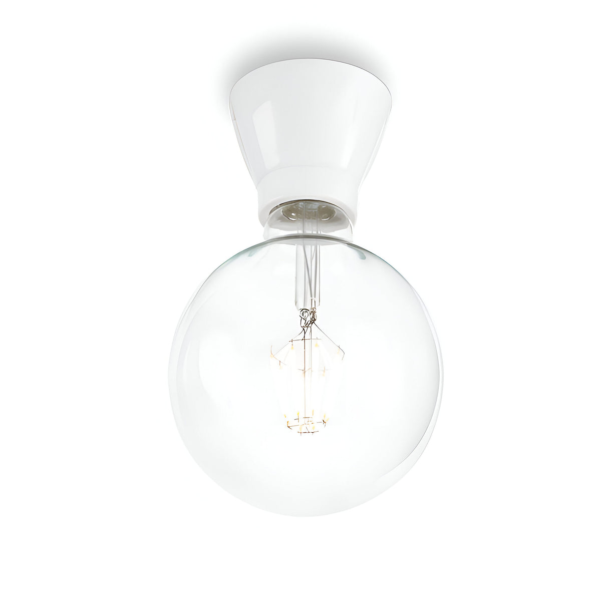 Introducing the Prismis Ceiling Light - White: a modern ceiling fixture showcasing a large, clear glass globe with an exposed filament bulb. Its sleek cone-shaped base, finished in white enamel, perfectly enhances its minimalist and contemporary design.