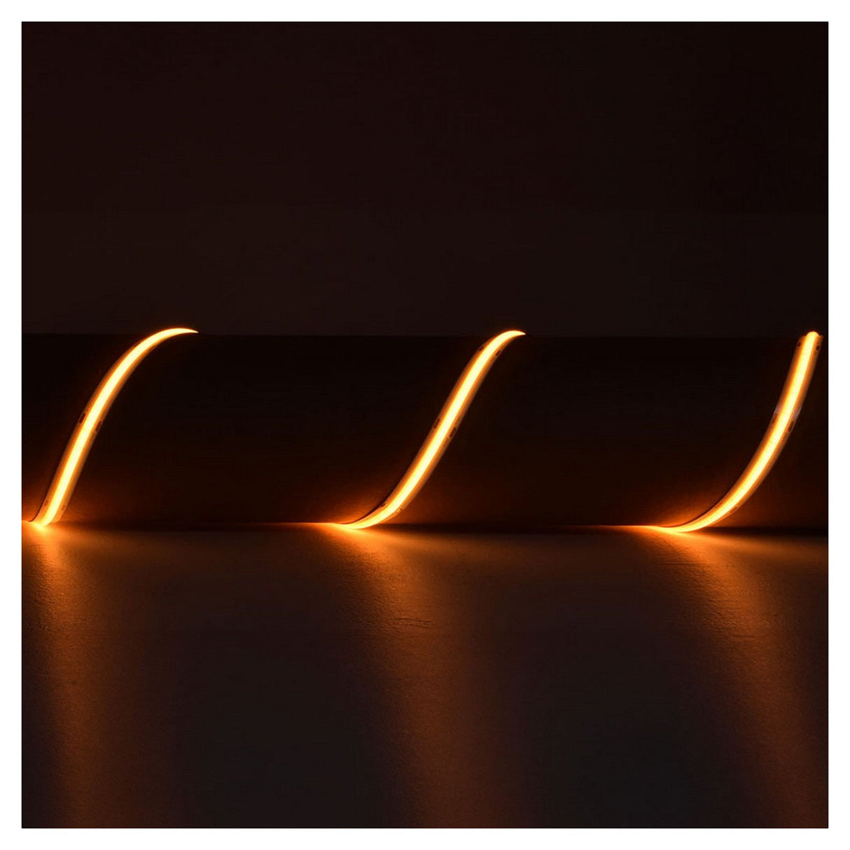 A series of glowing orange light trails, crafted with the LYYT 24V COB Strip Light 5m - 2000K technology, curve gracefully in a dark space, providing seamless 'no spot' illumination for a dynamic and abstract visual effect.