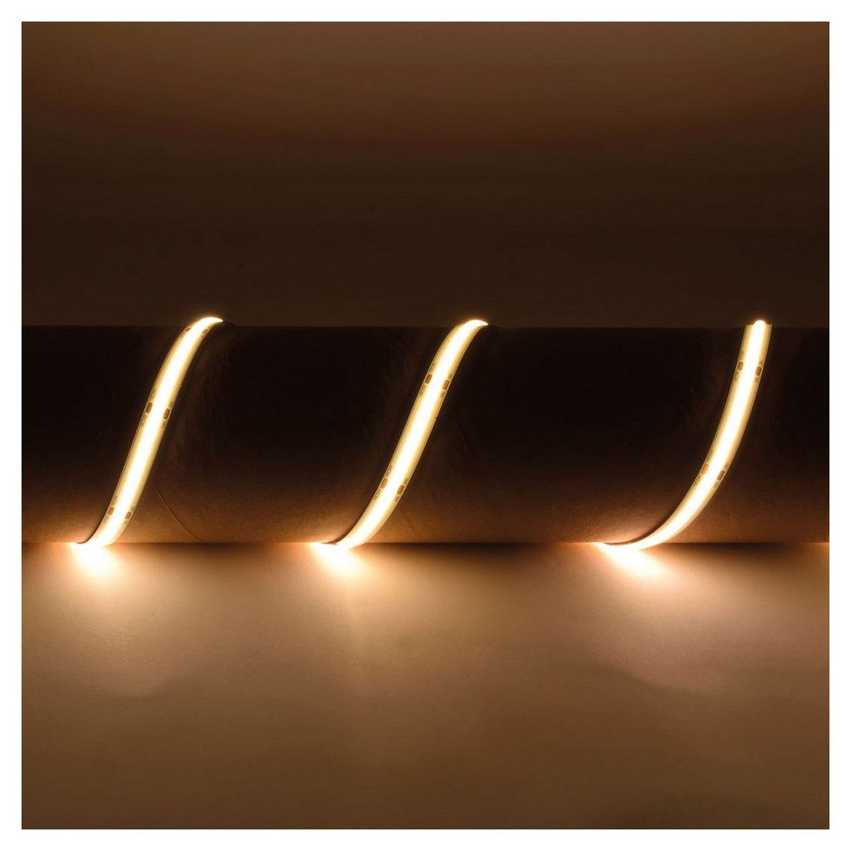 A LYYT IP65 24V COB LED Strip Light 5m - 3000K, laid out in an S-shaped design on a dark surface, emits a soft glow with no spot lighting. This water-resistant strip light enhances the ambiance with warmth and coziness.