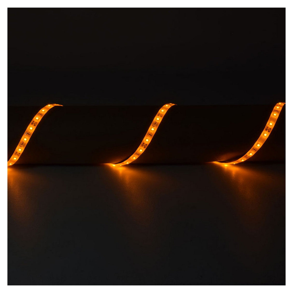 A dark room with LYYT 12V LED Strip Light 5m - Amber, featuring IP65-rated LED strips arranged in a wavy pattern, glowing in orange against a black background, emphasizing their low power consumption.