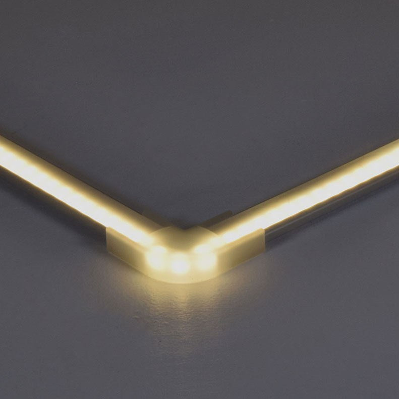 LYYT translucent corner connector by AVSL joining two warm white LED strip profiles at a 90-degree angle on a grey background.