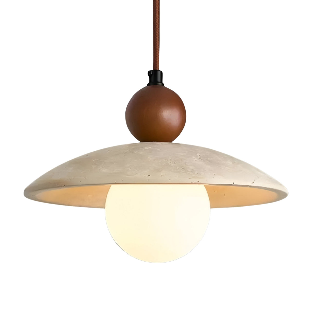 The Trevano 1 Light Dome Travertine Pendant features a round white globe bulb, a wide light beige lampshade, and a walnut brown accent above the shade, all suspended by a brown cord.
