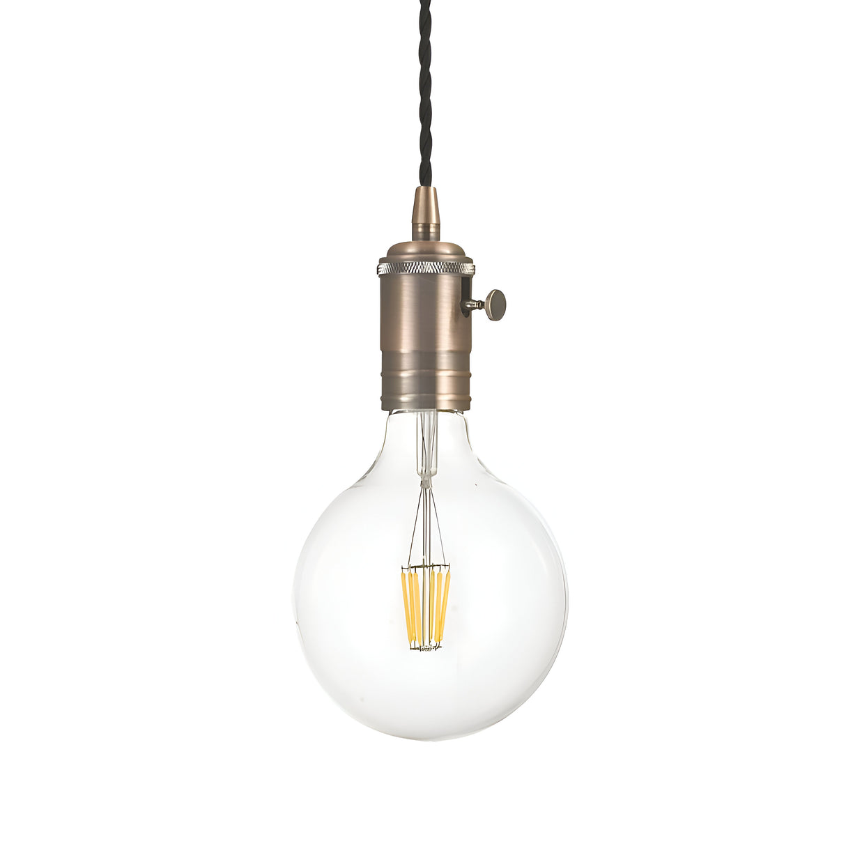 The Lantern 1 Light Pendant - Bronze features a vintage-style design with a visible filament lightbulb hanging from a twisted black cord. It has a clear glass exterior and a metallic socket, showcasing an exposed bulb style that captures a retro aesthetic.