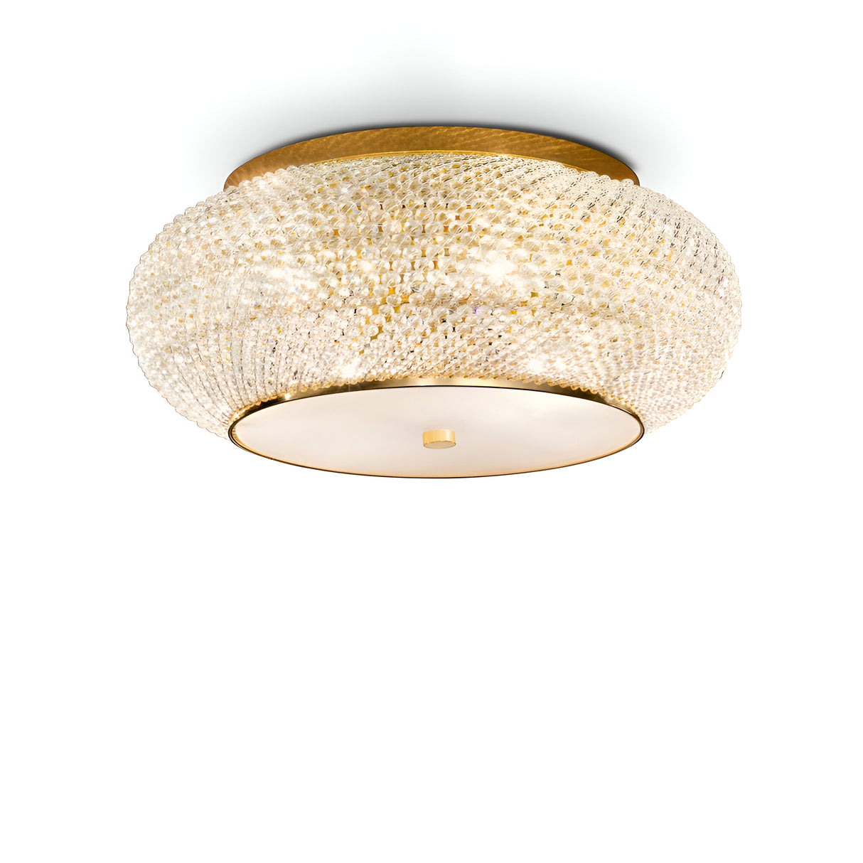The Harbor 14 Light Crystal Flush - Gold is a round, ornate ceiling light fixture that features a beautiful gold finish and a textured design. Its central circular detail at the base exudes luxurious lighting elegance against a plain white background.