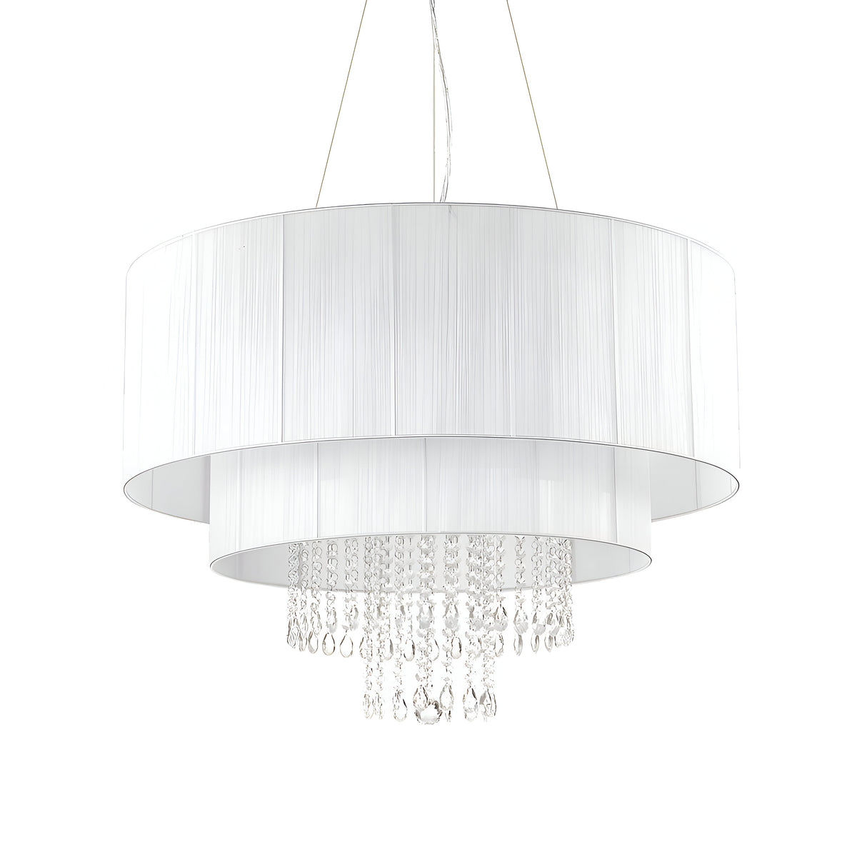 The Brillis Crystal 10 Light Chandelier - White features two cylindrical white fabric shades and crystal pendants arranged in layered tiers, merging elegant lighting with a contemporary design. Ideal for modern interiors, it is suspended by thin wires for a sleek finish.