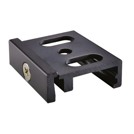 The Brillia Trimless Track Bracket Surface - Black is a mounting accessory perfect for track lighting systems, featuring a black metal construction with three differently sized holes, a side screw, and a rectangular base with a grooved side for precise object securing.