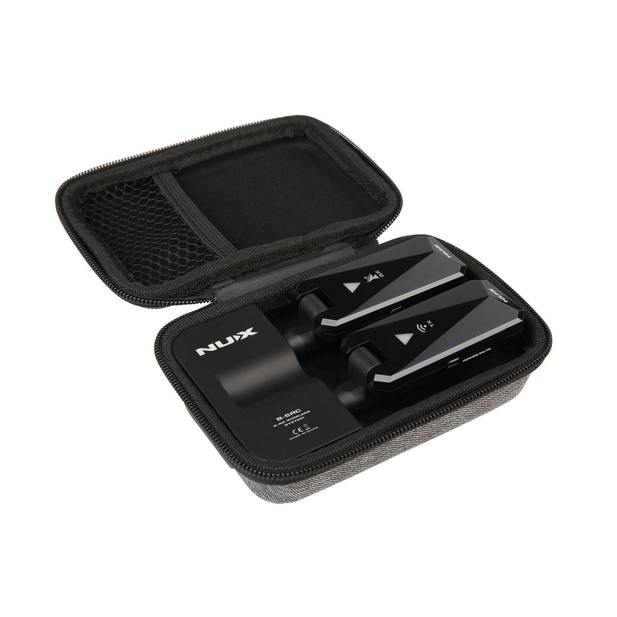 An open black zippered case holds two wireless microphone transmitters that are part of the NU-X B-5RC Rechargeable Guitar Bug Set 2.4GHz. The case includes a mesh pocket on the left side and prominently displays the brand name XILIN on one device, guaranteeing 24-bit audio quality for exceptional sound.