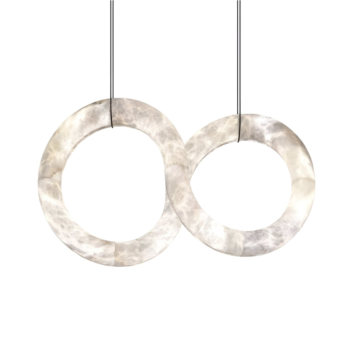 The Serava LED Alabaster Loop Suspension Light – Soft White features two intertwined Spanish alabaster rings, crafted from translucent marble-like material and suspended by thin black cables against a white background.