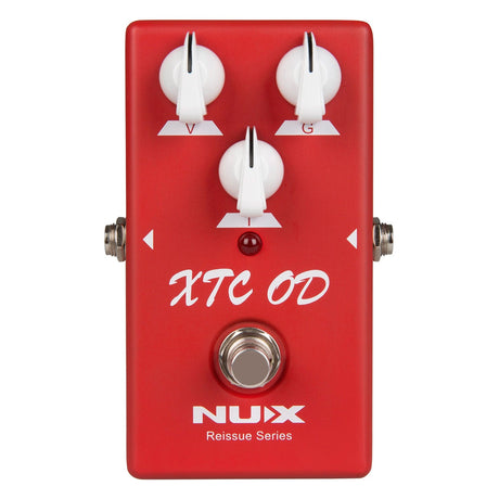 The NU-X Reissue XTC OD Pedal is a red drive pedal with three white control knobs labeled V, G, and I. It features a silver footswitch at the bottom and has "XTC OD" displayed in white lettering on the front. The pedal incorporates true bypass technology, with "NUX Reissue Series" printed at the bottom.
