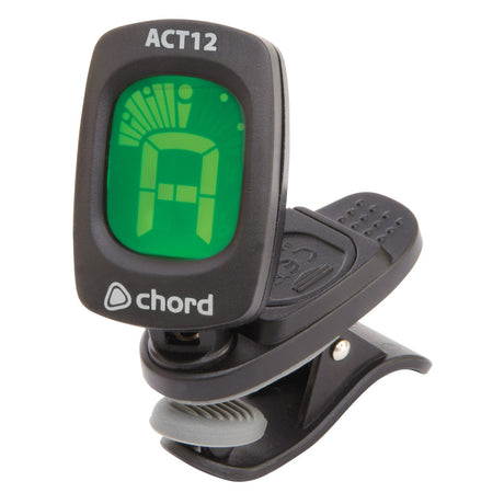 The Chord ACT12 Auto Clip Tuner, a stylish black guitar tuner, boasts a green digital display with a virtual needle indicating the note A. It offers auto chromatic tuning and is showcased elegantly against a white background.