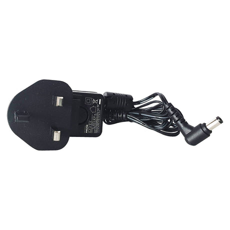 The NU-X Pedal Power Adaptor 9V DC 500ma features a neatly coiled black cable attached to a UK three-pin plug. This switch-mode power adaptor is ideal for 9Vdc effect pedals and comes equipped with a right-angled DC connector. For added peace of mind, safety information and certification marks are clearly printed on the plug.