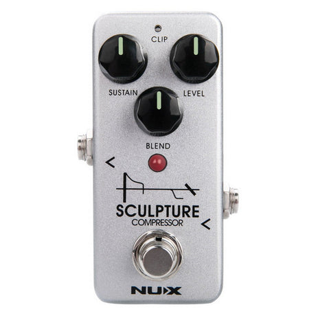 Image of a NU-X Sculpture Compressor Pedal. It showcases three black knobs for customizing sustain, level, and blend control, along with a Clip switch. A red LED indicator and a footswitch are also featured. The pedal shines with its silver finish highlighted by black text.