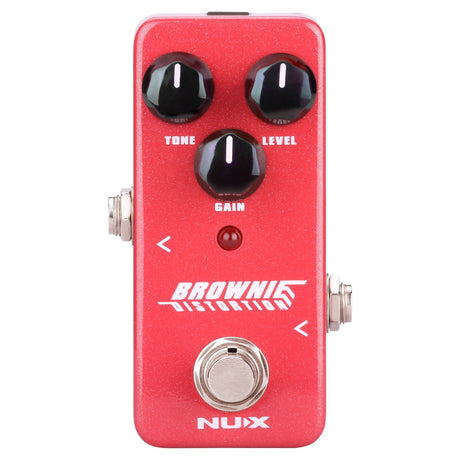 The NU-X Brownie Distortion Pedal offers genuine British distortion sounds, controllable via three black knobs labeled Tone, Level, and Gain. Featuring side input/output jacks and a footswitch at the bottom, it's ideal for capturing classic rock tones in your setup.