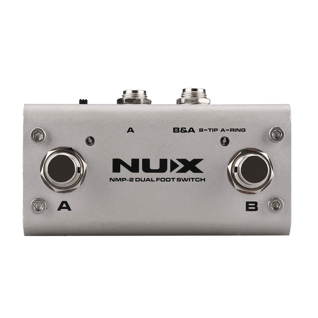 Image of the NU-X NMP-2 Dual Foot Controller in silver, perfect for managing guitar effects. It includes buttons A and B, along with two input/output jacks at the top, ideal for connecting instruments. This versatile foot switch controller is designed to seamlessly manage musical effects.