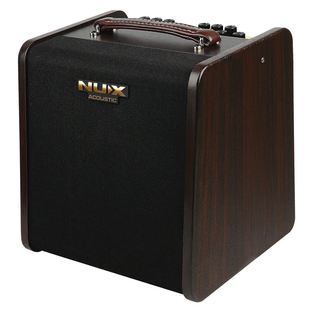 The NU-X Stageman II AC-80 Acoustic Amplifier boasts a sleek black front panel, complemented by wooden sides and topped with a brown leather handle. It includes Bluetooth audio streaming capabilities and convenient control knobs for easy access on the upper surface.