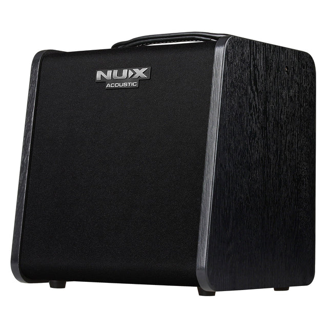 The NU-X Stageman II AC-60 Acoustic Amplifier is a black amplifier with a sleek, modern design. It includes a sturdy handle on top and a textured finish. The brand's logo is prominently displayed on the front, and it supports Bluetooth audio streaming for versatile connectivity.